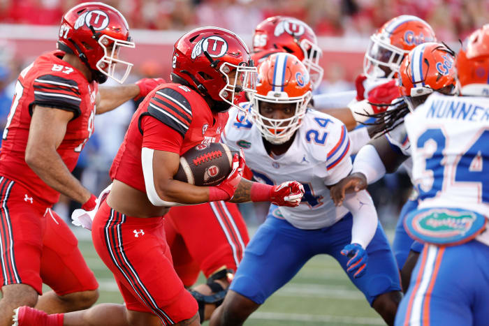 Aug 31, 2023; Salt Lake City, Utah, USA; Utah Utes running back Micah Bernard (2) runs the ball in the first half against the Florida Gators at Rice-Eccles Stadium. Mandatory Credit: Jeff Swinger-USA TODAY Sports